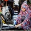Hajah Khairi, saat bekerja di bengkel nya yang terletak di Sp2, Kabupaten Mimika. (Foto: Kristina Rejang)