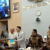 John Gobai saat menyerahkan Laporan Tailing Freeport Komisi XII DPR RI ke Timika. (Foto: Ist)